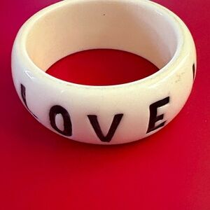 LOVE bangle ivory with black lettering measurements 2 1/2 wide & 1 1/4 high